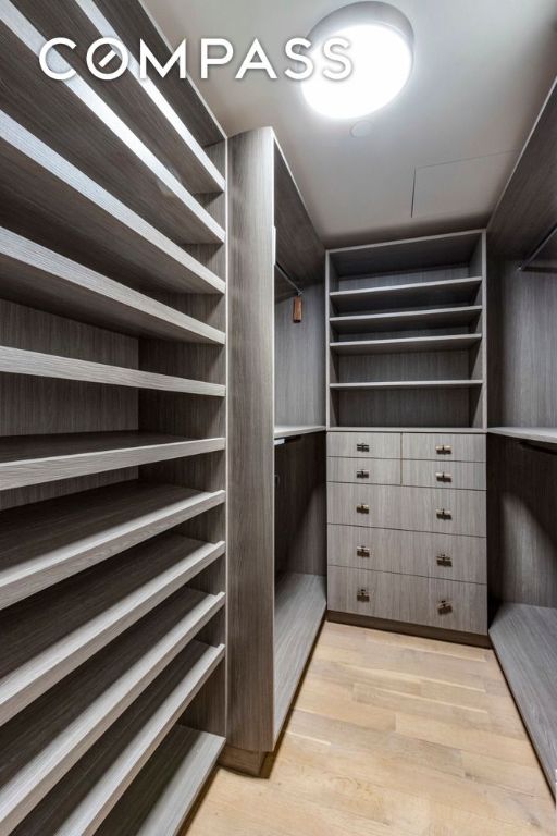 walk in closet featuring light wood-type flooring