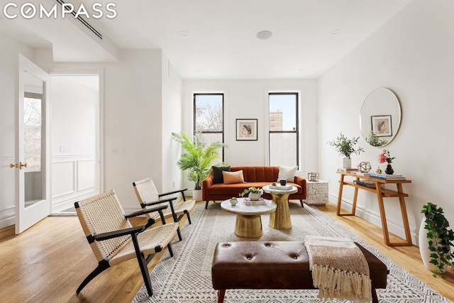 living area with light hardwood / wood-style flooring