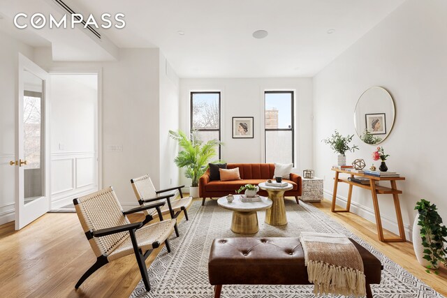 living area with light hardwood / wood-style flooring