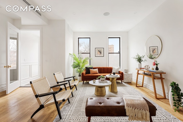 living room featuring light wood-style floors and baseboards