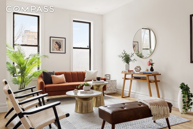 sitting room featuring hardwood / wood-style floors