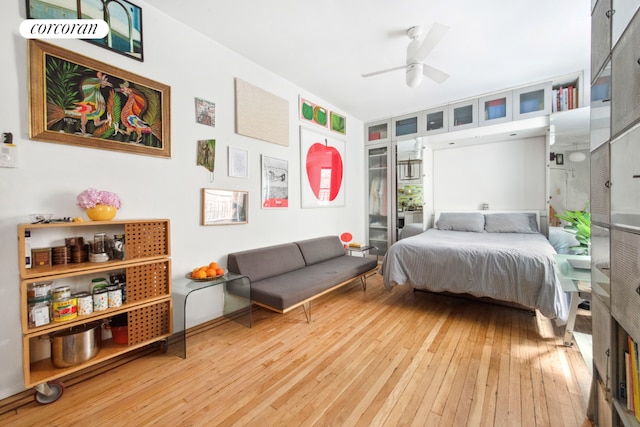 bedroom featuring light hardwood / wood-style floors and ceiling fan