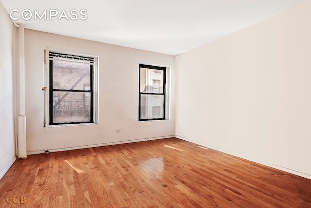 spare room featuring light hardwood / wood-style floors