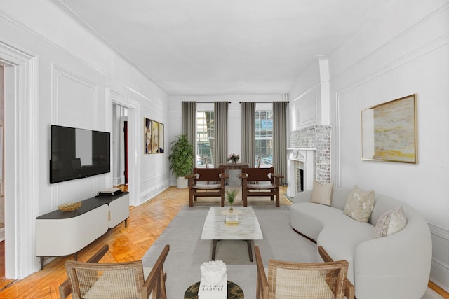 living room featuring a brick fireplace