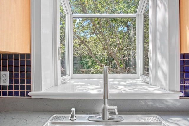 details featuring light countertops and a sink