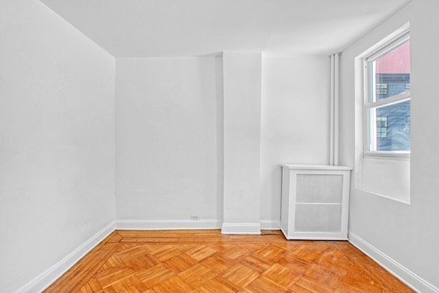 empty room featuring baseboards