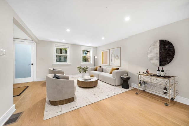 living room with light hardwood / wood-style floors