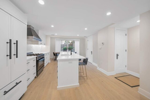 bedroom featuring access to exterior and hardwood / wood-style floors