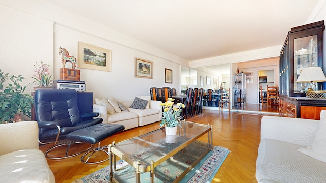 living room featuring parquet floors