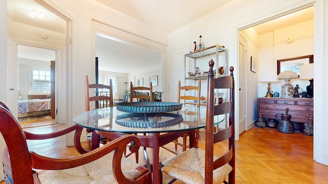 dining room featuring light parquet flooring