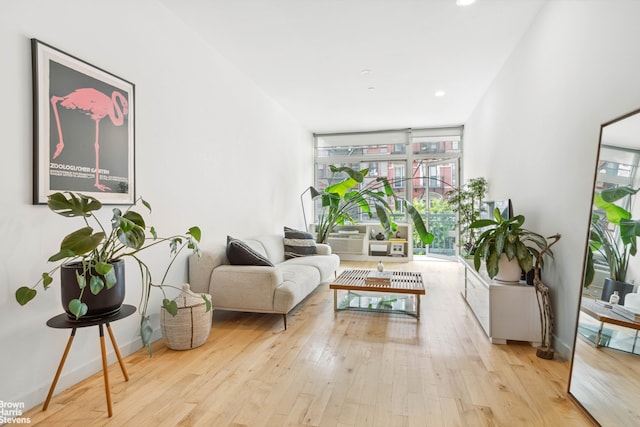 interior space with recessed lighting, baseboards, and wood finished floors