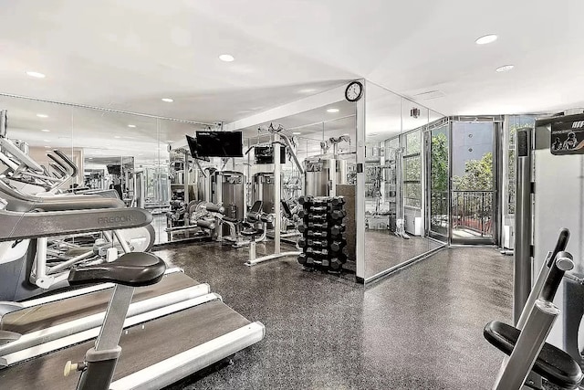 gym with a wall of windows