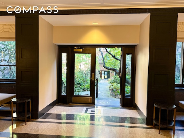 entrance foyer with baseboards and recessed lighting