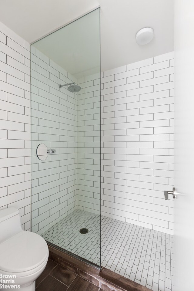 15 William St Unit 21A, New York City, NY 10004 - full bathroom featuring a stall shower and toilet
