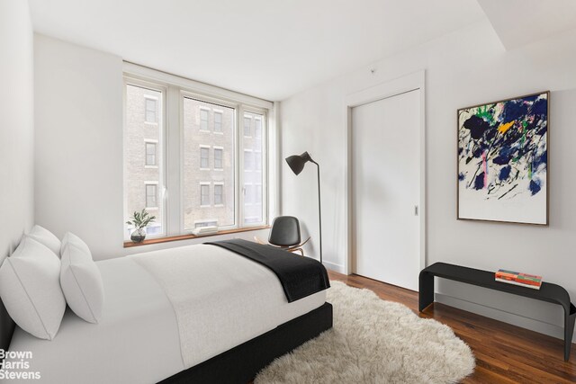 15 William St Unit 21A, New York City, NY 10004 - bedroom with baseboards and wood finished floors