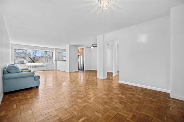 dining room featuring ceiling fan with notable chandelier