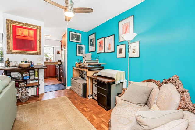 office area featuring parquet floors and a ceiling fan