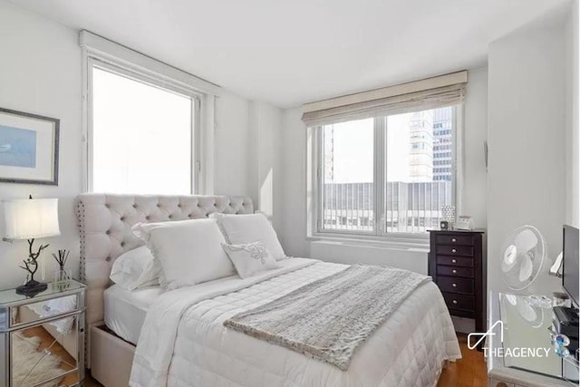 bedroom with wood finished floors