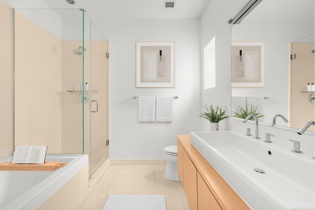 119 Fulton St Unit 10, New York City, NY 10038 - full bathroom with a shower stall, toilet, tile patterned floors, vanity, and baseboards