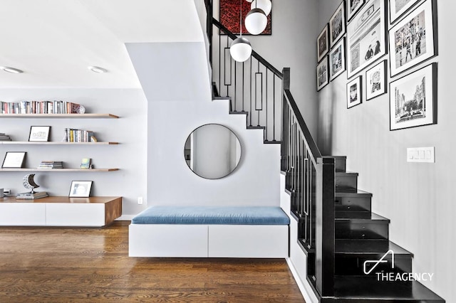 staircase with wood-type flooring