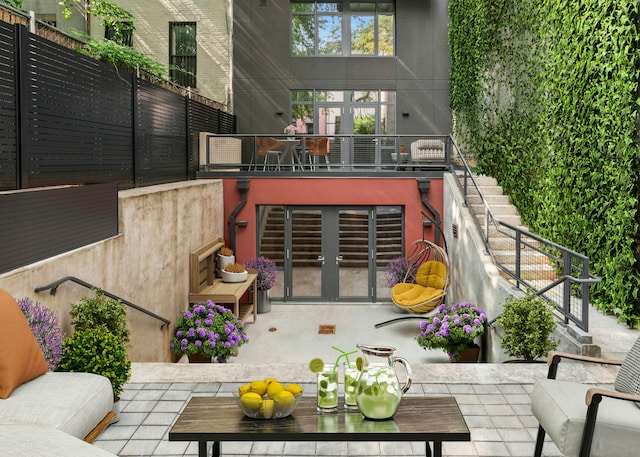 rear view of property featuring an outdoor living space, stairs, stucco siding, outdoor dining area, and a patio