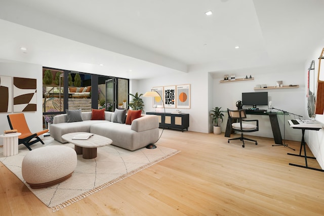 living room with recessed lighting and wood finished floors