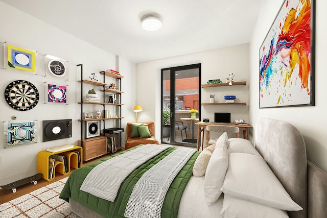 bedroom featuring access to outside and wood finished floors