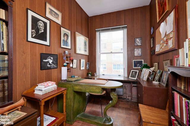 office space featuring wood walls and parquet flooring