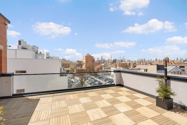 view of patio featuring a balcony and a city view