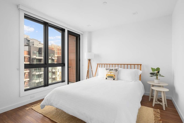 bedroom featuring dark hardwood / wood-style flooring