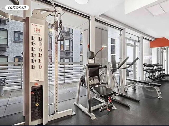 workout area featuring floor to ceiling windows