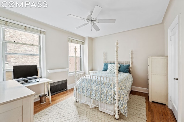 bedroom featuring ceiling fan and wood-type flooring