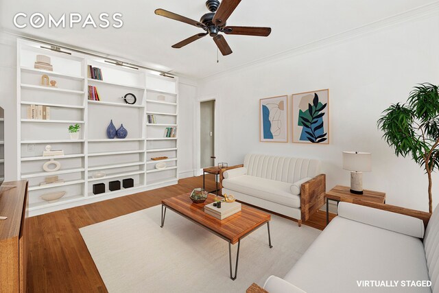 living room featuring ceiling fan, wood-type flooring, and ornamental molding