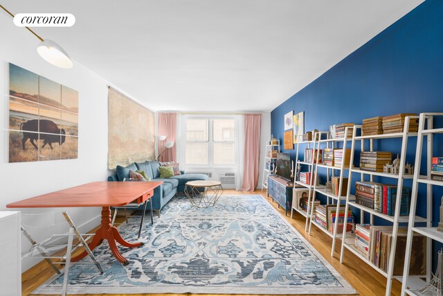 bedroom with hardwood / wood-style flooring