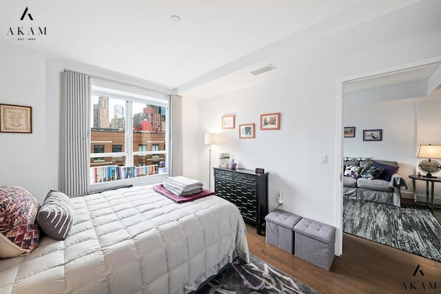 bedroom with hardwood / wood-style flooring