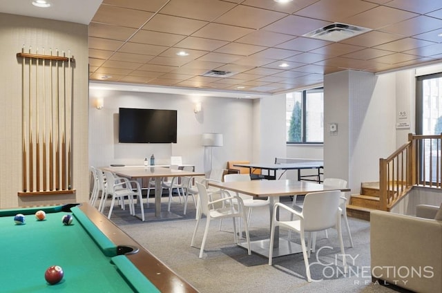 recreation room featuring a drop ceiling, plenty of natural light, and visible vents