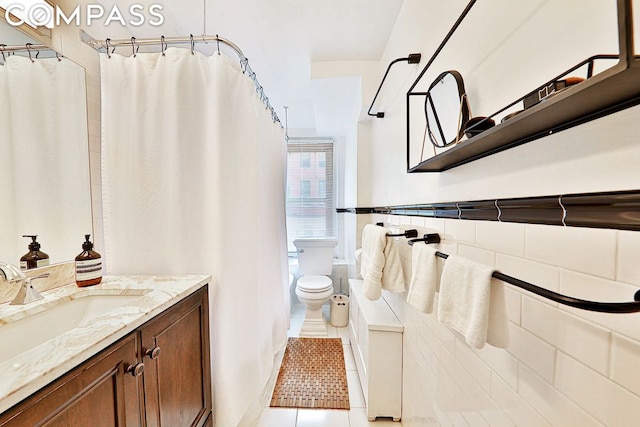 bathroom featuring vanity, tile patterned floors, toilet, and a shower with shower curtain