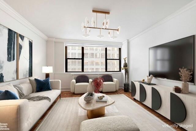 living room featuring ornamental molding and an inviting chandelier