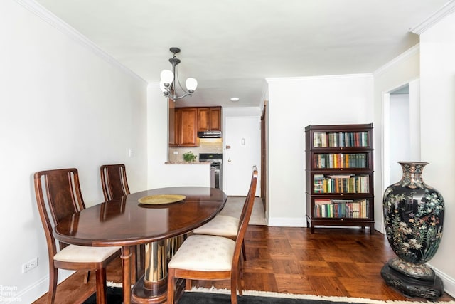 dining space featuring crown molding, dark parquet floors, and a chandelier