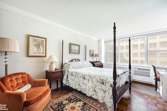 bedroom featuring ornamental molding, a wall mounted AC, and dark parquet floors