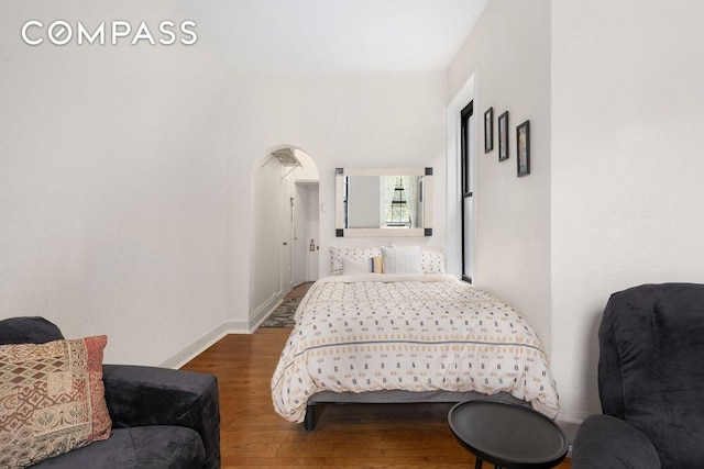 bedroom featuring dark hardwood / wood-style flooring