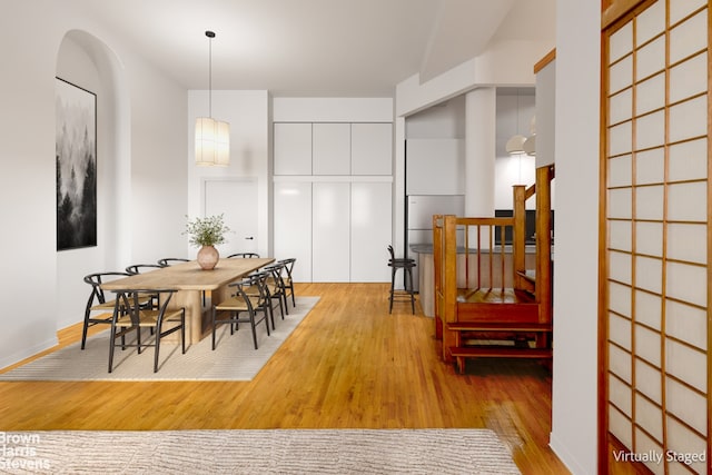 dining space with light hardwood / wood-style floors