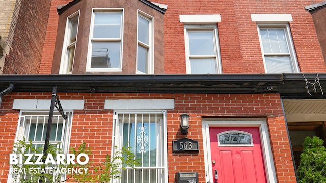 563 W 182nd St, New York City, NY 10033 - doorway to property featuring brick siding