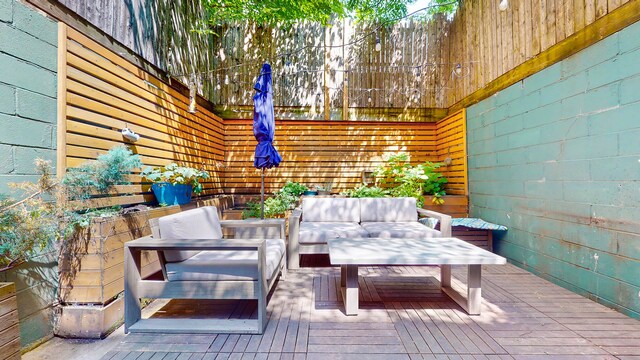 563 W 182nd St, New York City, NY 10033 - view of patio with an outdoor hangout area and a wooden deck
