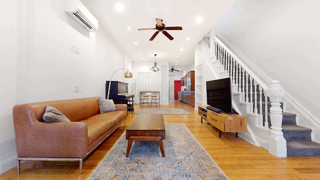 563 W 182nd St, New York City, NY 10033 - living room featuring a wall mounted AC, stairs, a ceiling fan, wood finished floors, and recessed lighting