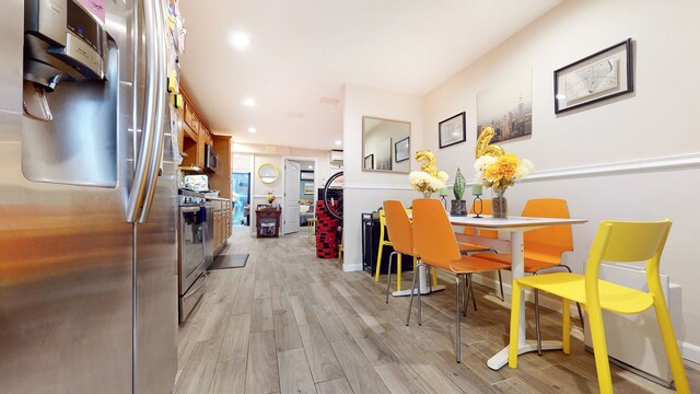 563 W 182nd St, New York City, NY 10033 - dining area with light wood finished floors, baseboards, and recessed lighting