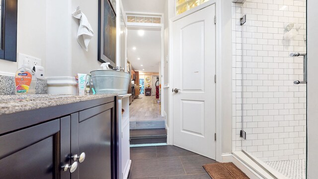 563 W 182nd St, New York City, NY 10033 - ensuite bathroom with a stall shower, vanity, and tile patterned floors