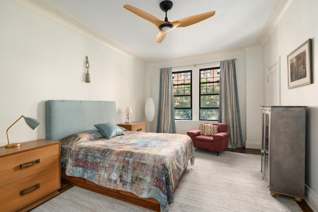 bedroom featuring ceiling fan and crown molding