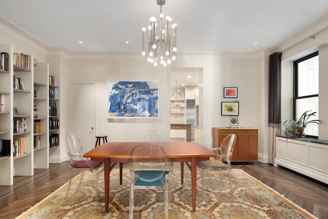 dining room with ornamental molding, dark parquet floors, and a notable chandelier