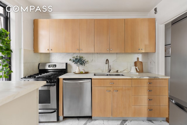 kitchen with marble finish floor, appliances with stainless steel finishes, backsplash, and a sink